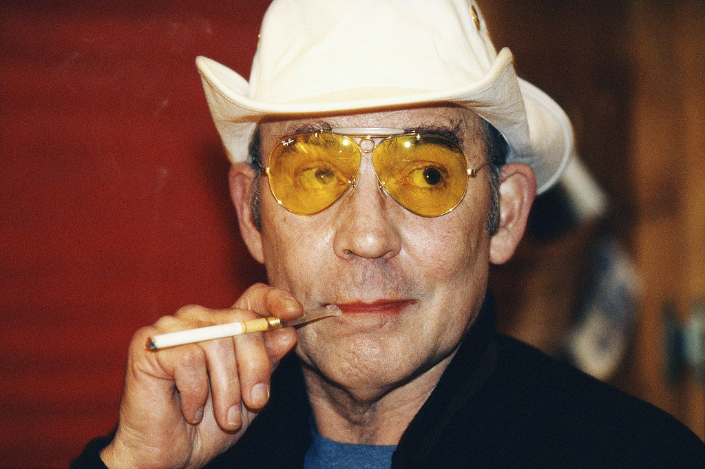 Hunter smoking a cigarette wearing a cowboy hat