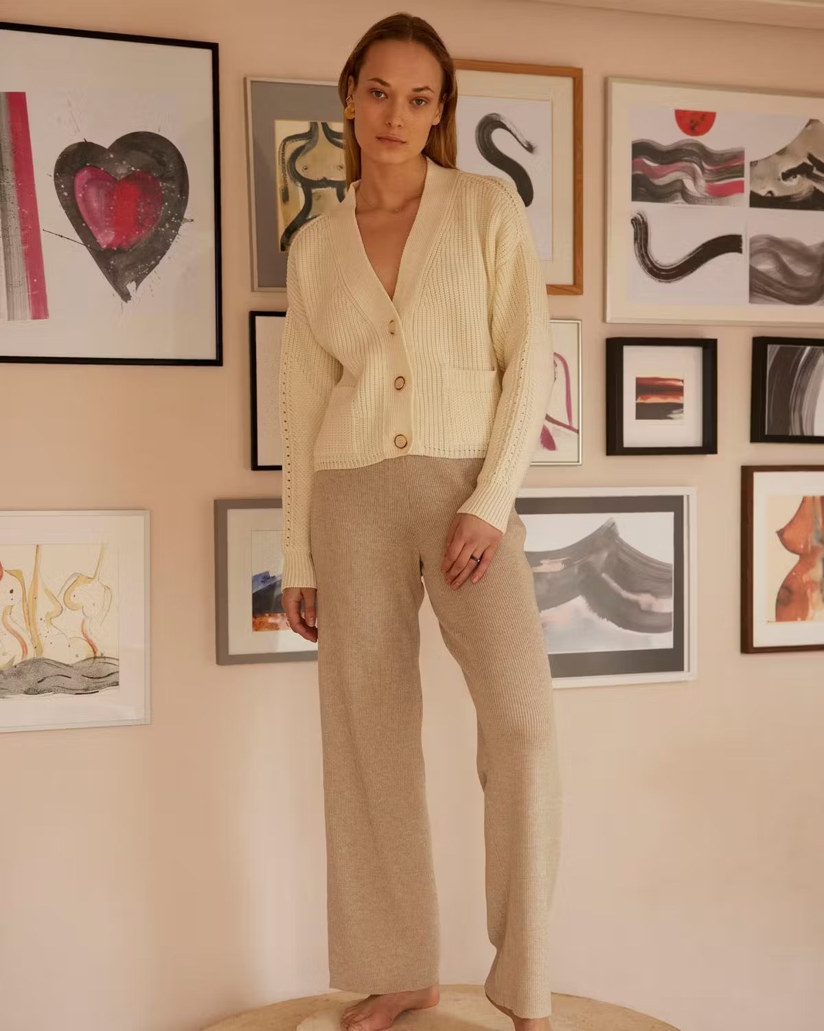 a model wearing the cardigan and pants