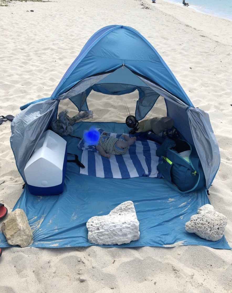The sun shelter with a baby in it