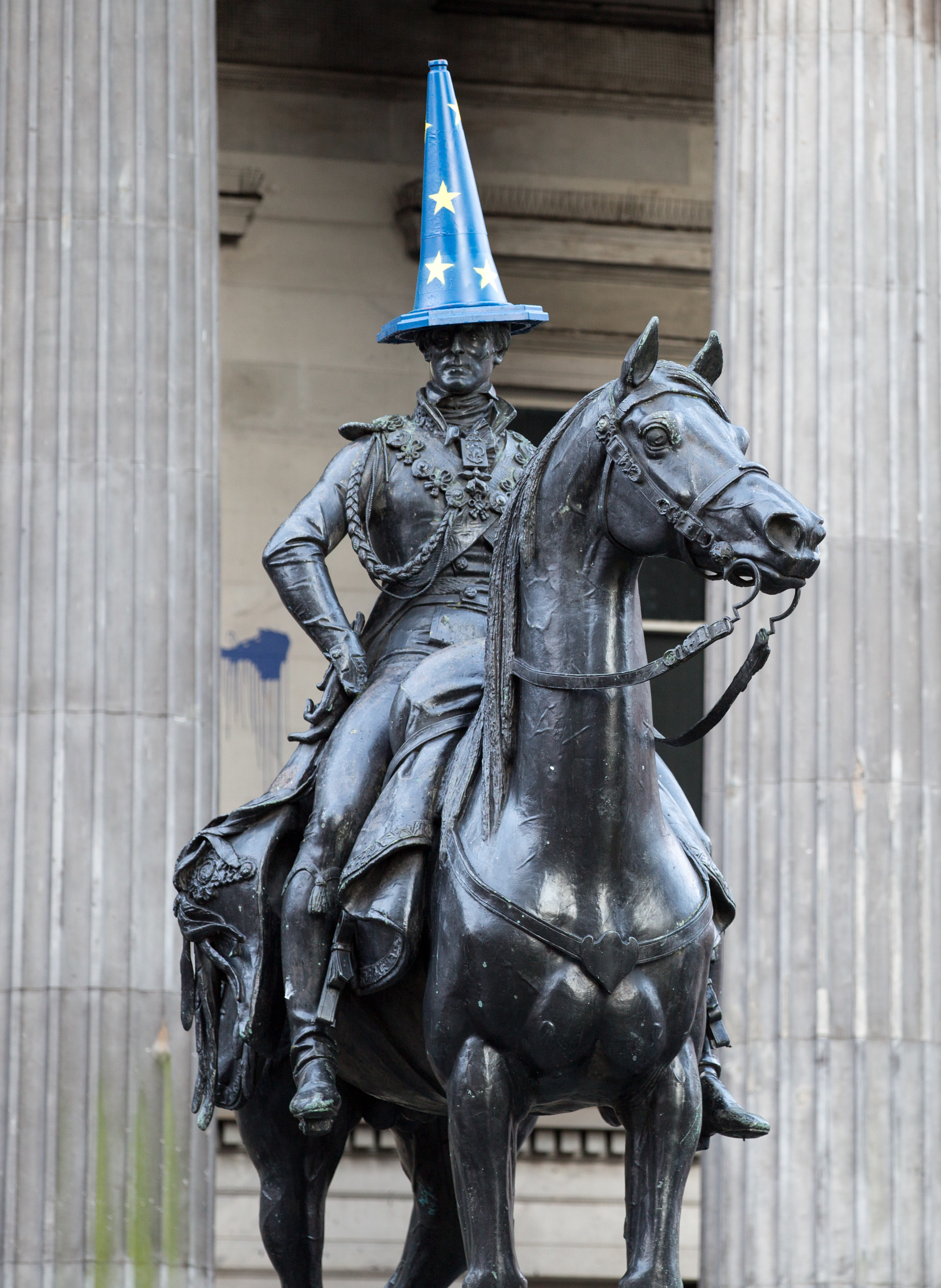 The iconic equestrian Duke of Wellington statue on Royal Exchange Square outside the Gallery of Modern Art (GOMA) sports an EU flag traffic cone on February 3, 2020