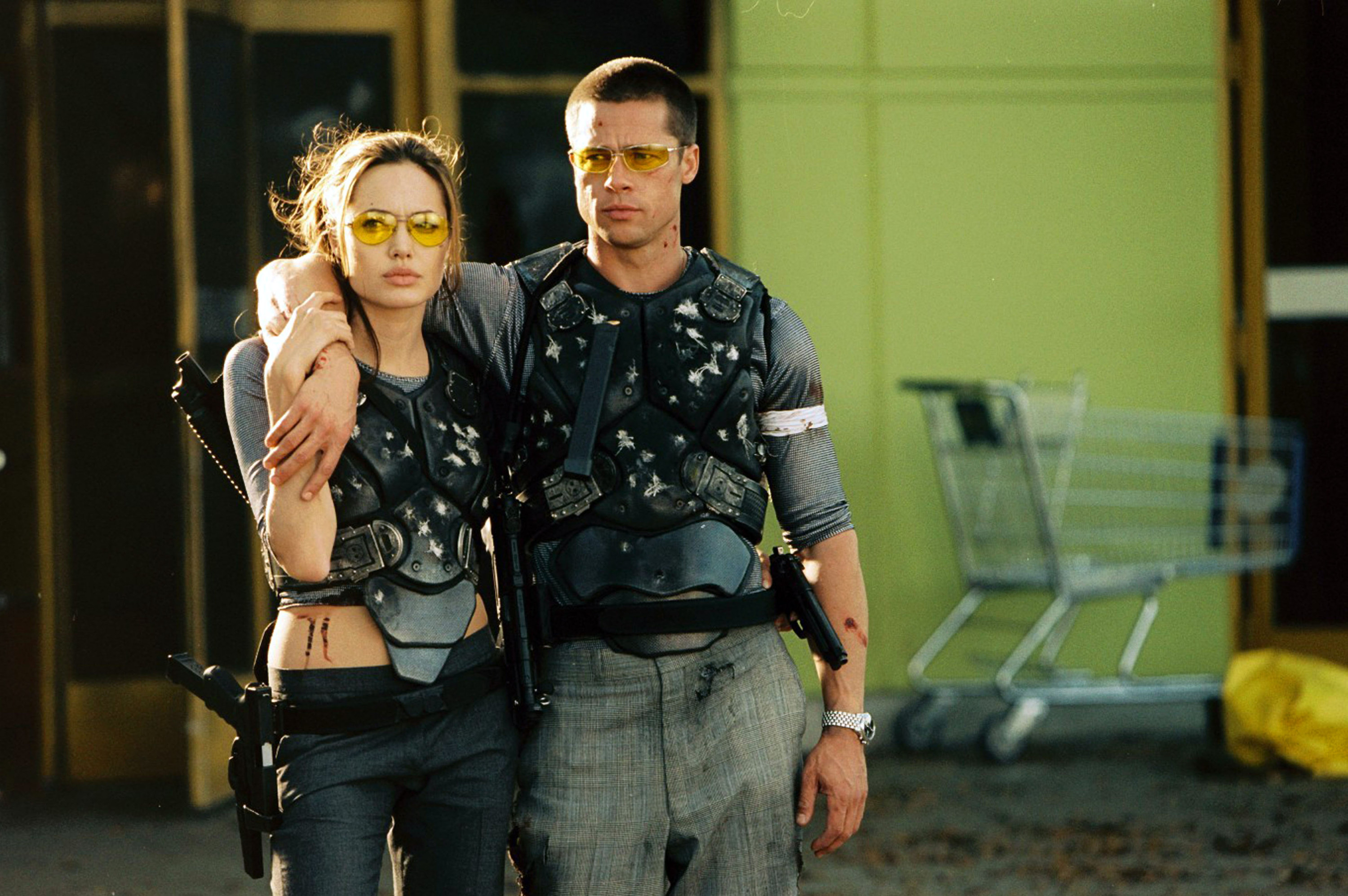 Brad Pitt and Angelina Jolie wear bullet-proof vests in a decrepit house