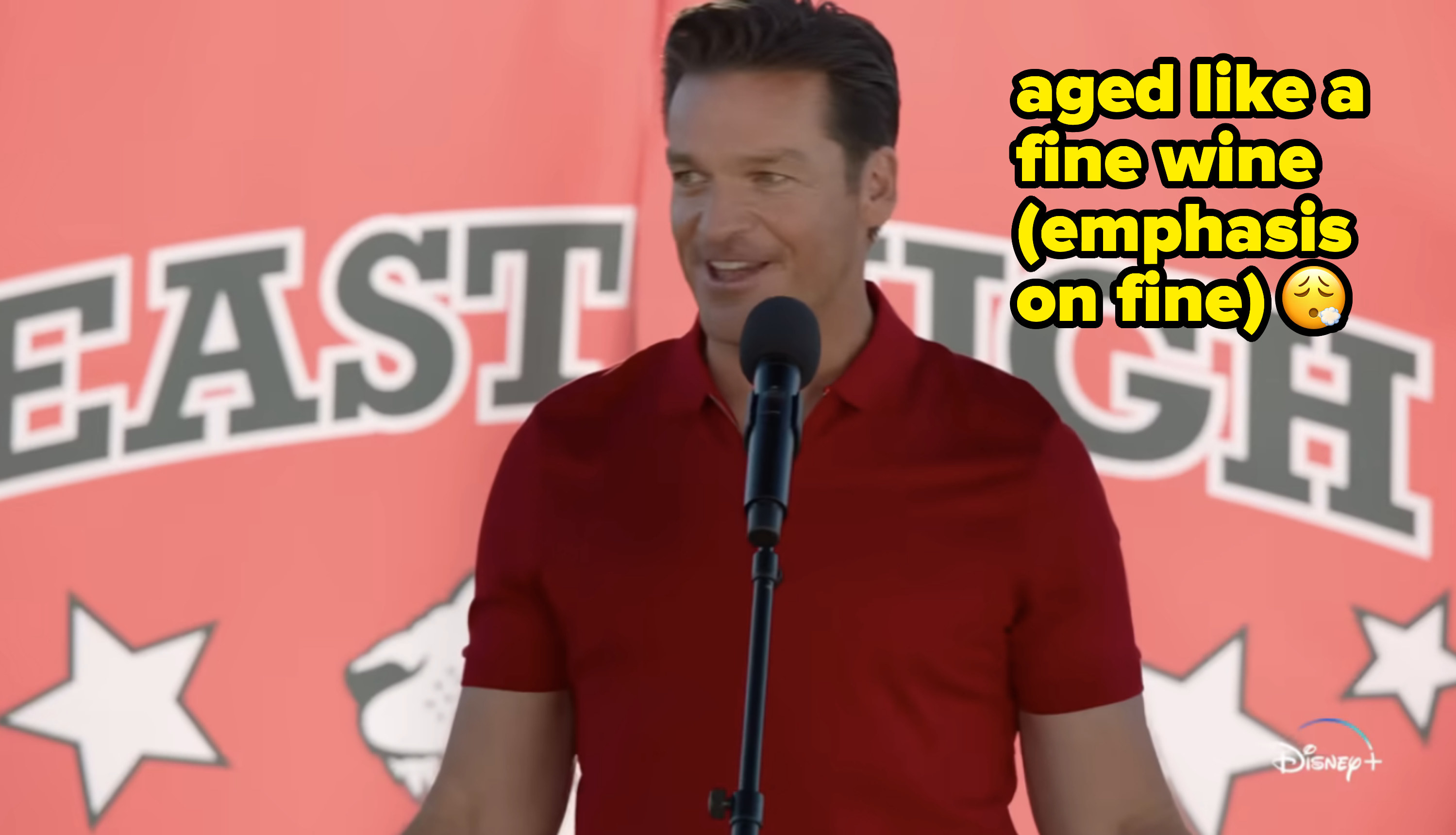 Bart Johnson as Coach Bolton in front of a microphone with caption, &quot;aged like a fine wine (emphasis on fine)&quot;