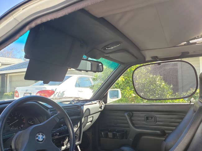 Reviewer's representation  of car   interior with model   shadiness  attached to window