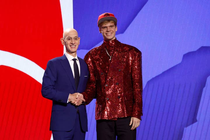 Gradey Dick (R) poses with NBA commissioner Adam Silver (L) after being drafted 13th overall pick by the Toronto Raptors