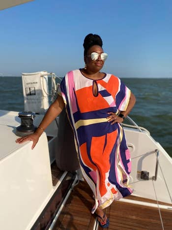 reviewer wearing the dress on a boat