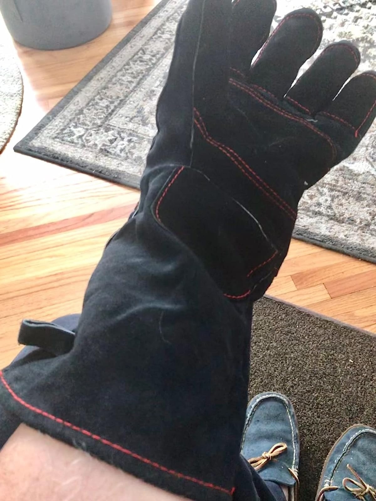 reviewer wearing black bite proof glove