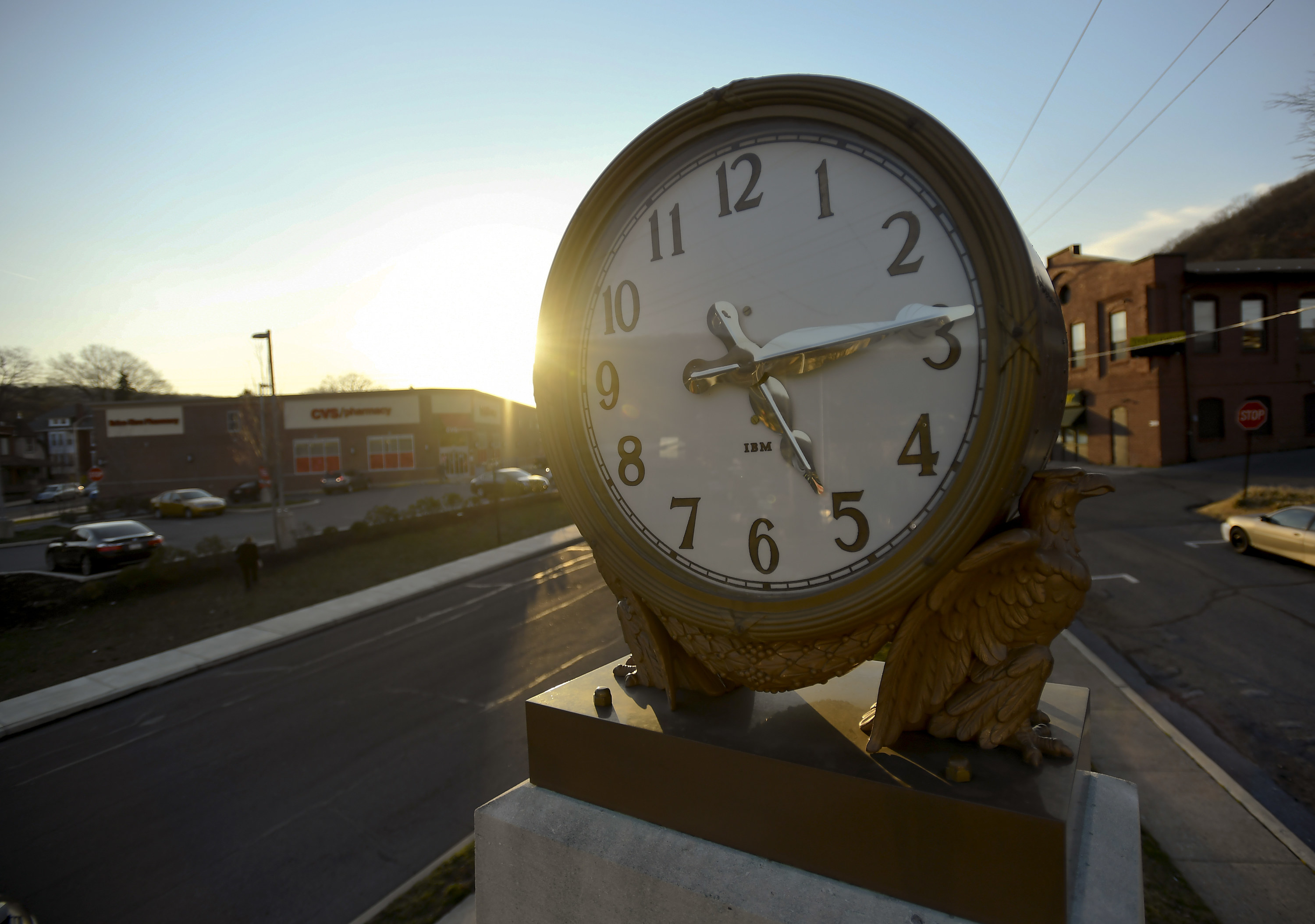Closeup of a clock on a town street