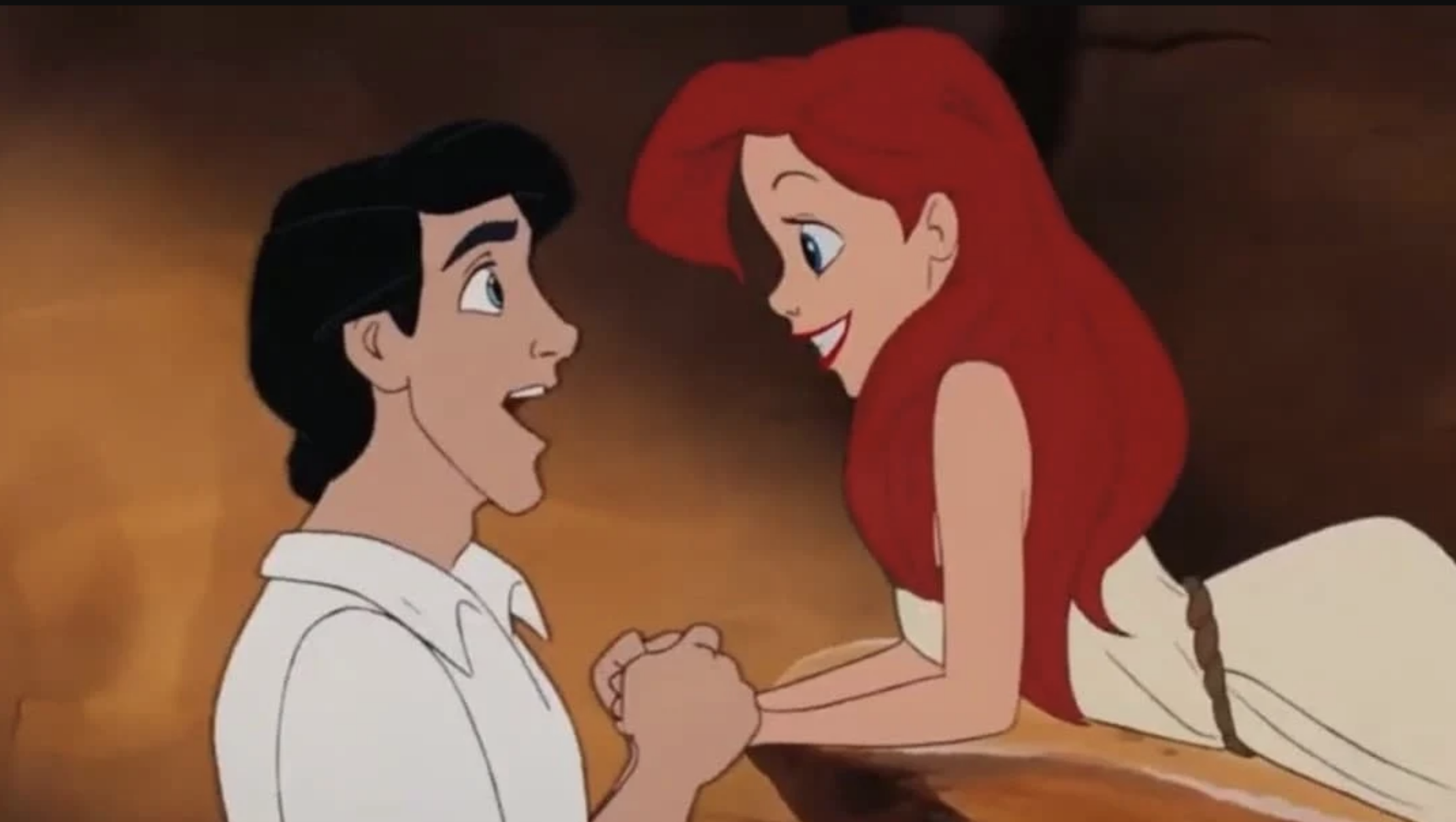 Animated Prince Eric and Ariel look into each other's eyes. He smiles with mouth open wide, she smiles with all teeth showing
