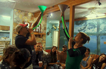 two people doing beer bongs
