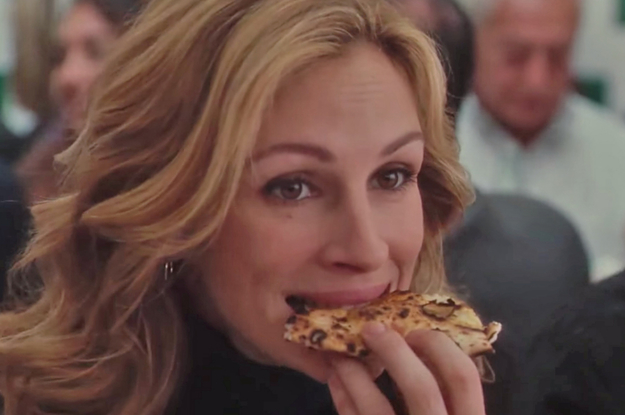 Julia Roberts eating a piece of pizza as Elizabeth in Eat, Pray, Love
