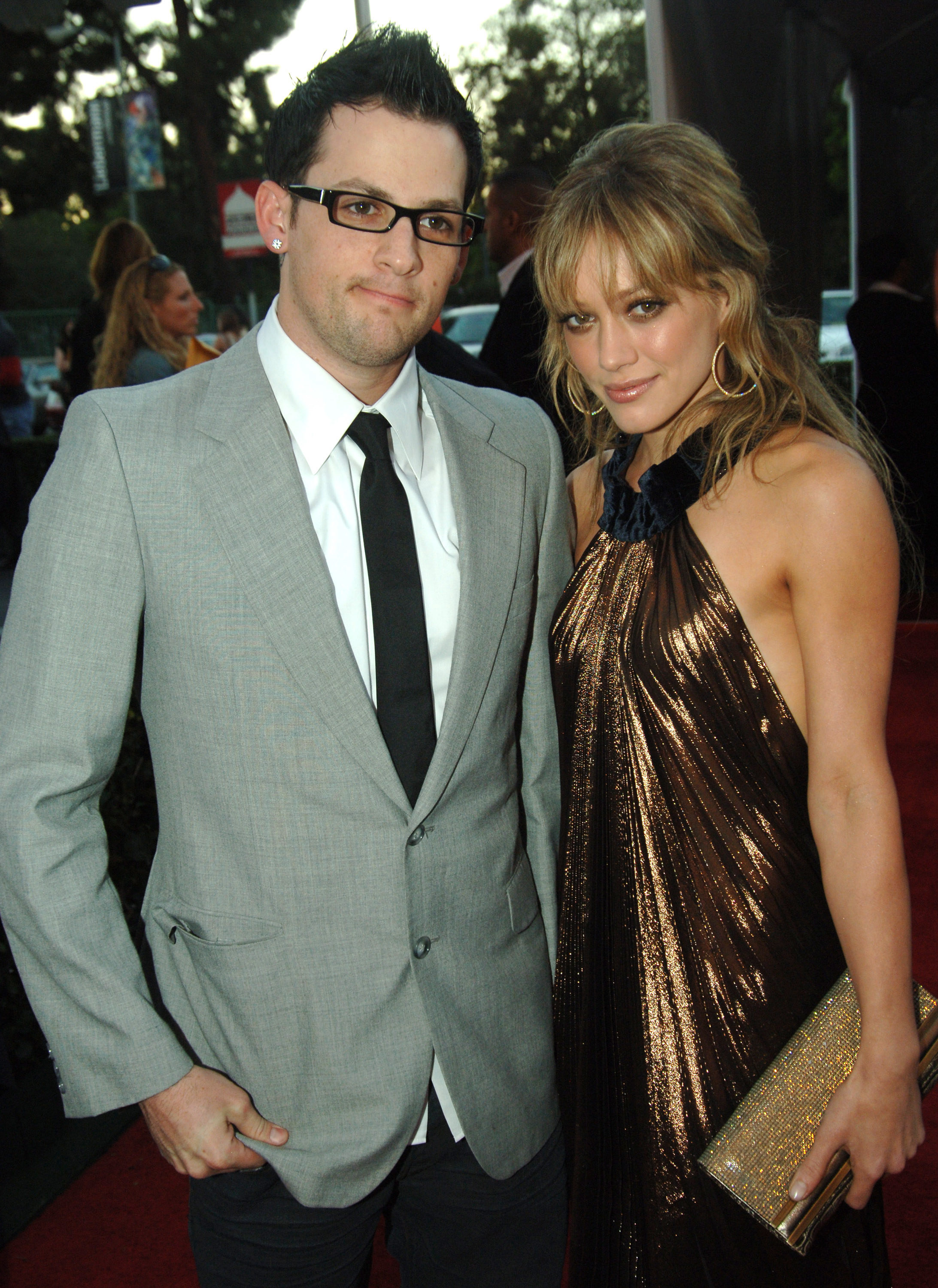Joel Madden in a gray-and-black suit and Hilary Duff in a bronze dress at the 33rd annual American Music Awards