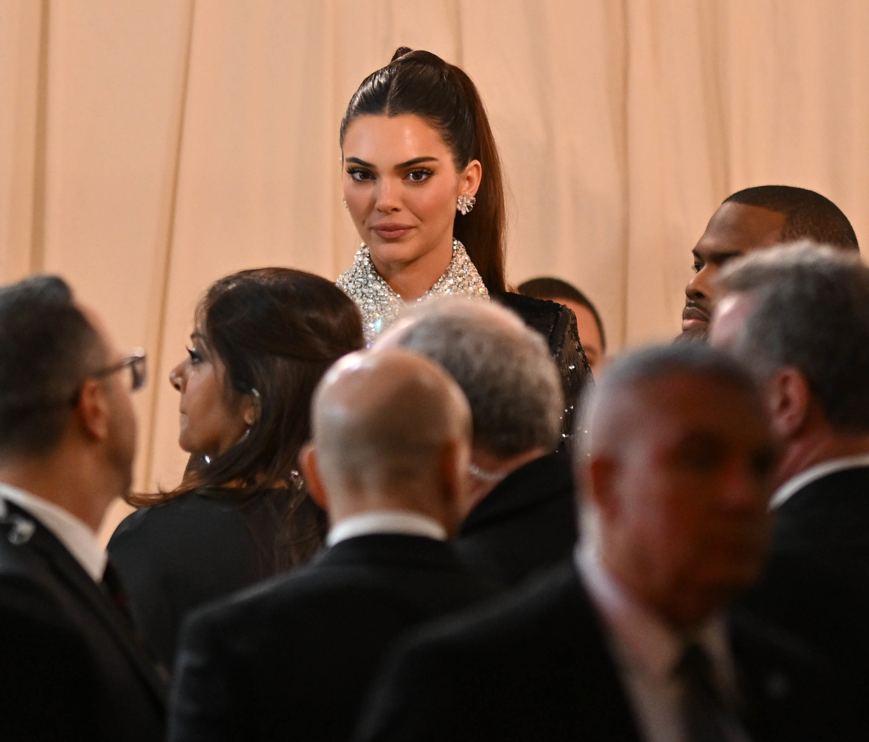 kendall towering over people at the met