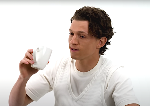 tom about to take a sip from a mug