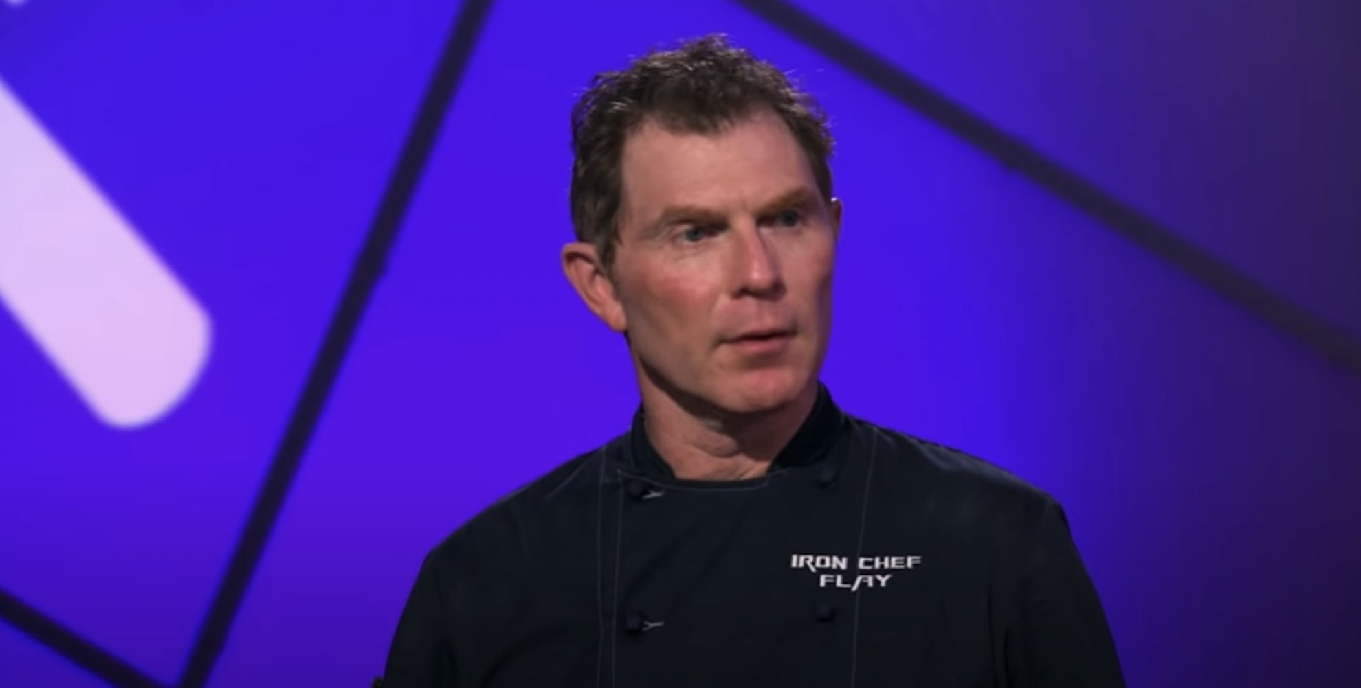 Bobby Flay in an Iron Chef uniform