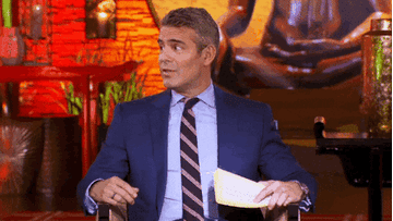 Andy Cohen smiling awkwardly