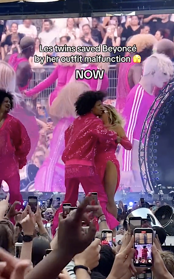 A backup dancer shielding Beyoncé