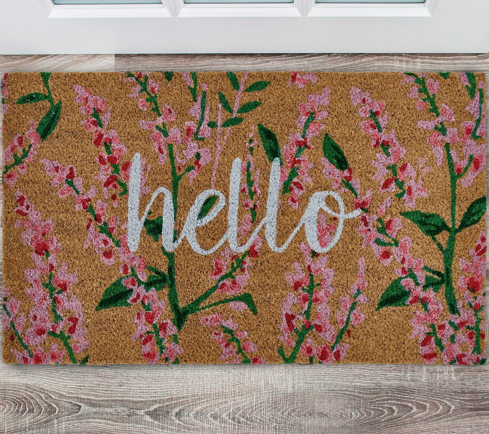 the mat with the word &quot;hello&quot; written on it and pink and green flowers