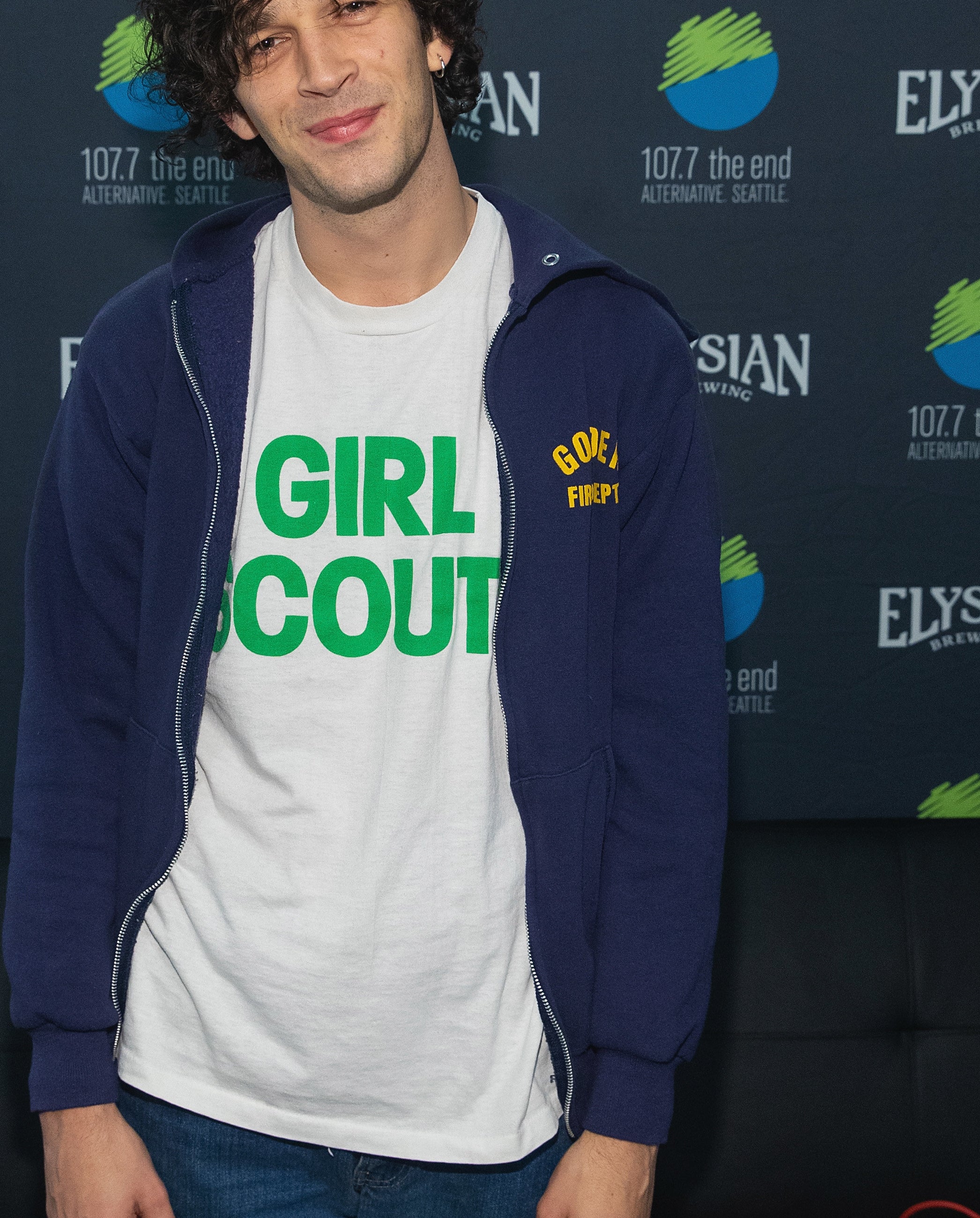 Close-up of Matt in a Girl Scouts T-shirt and hoodie