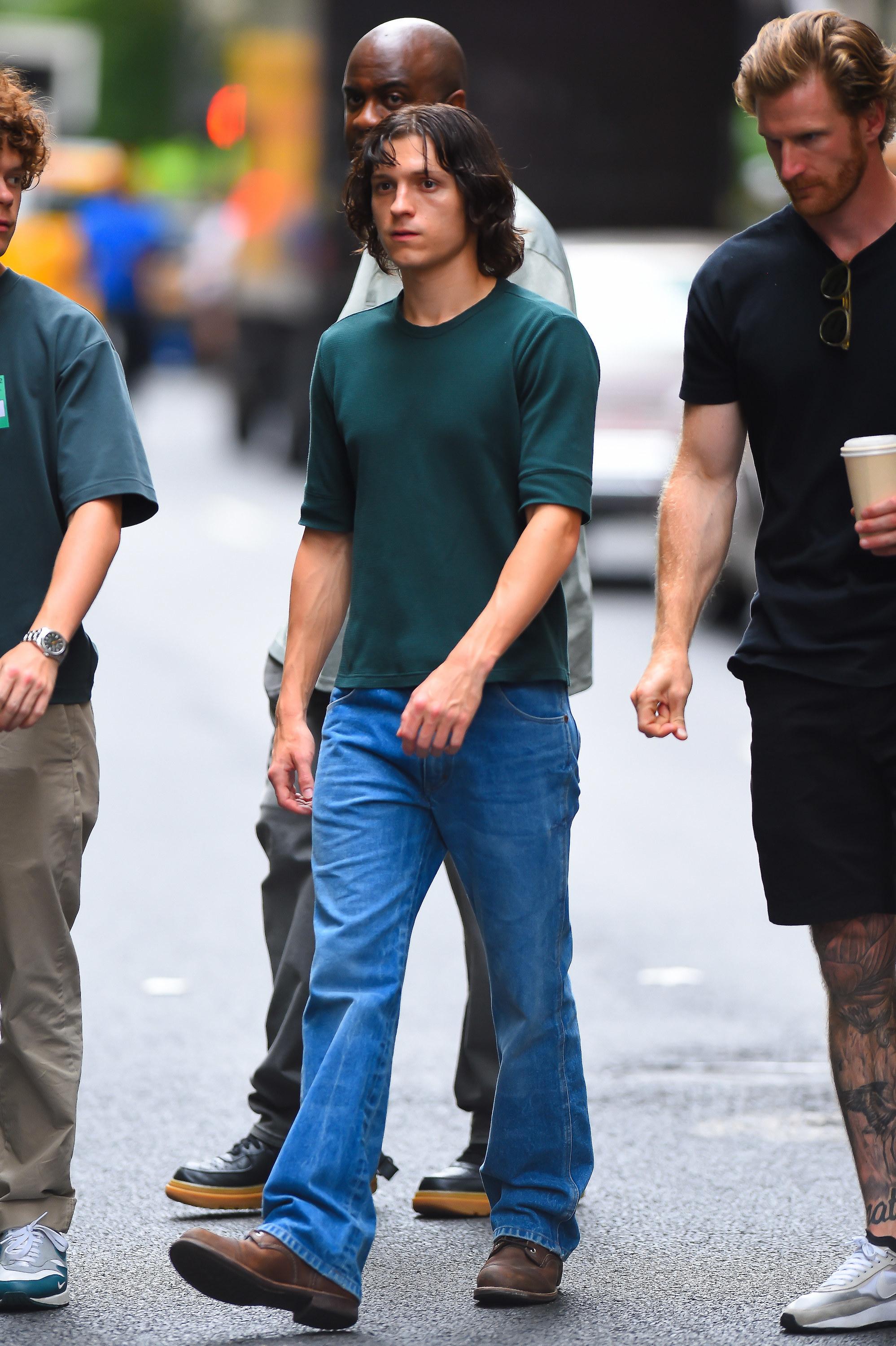 Close-up of Tom walking in a group