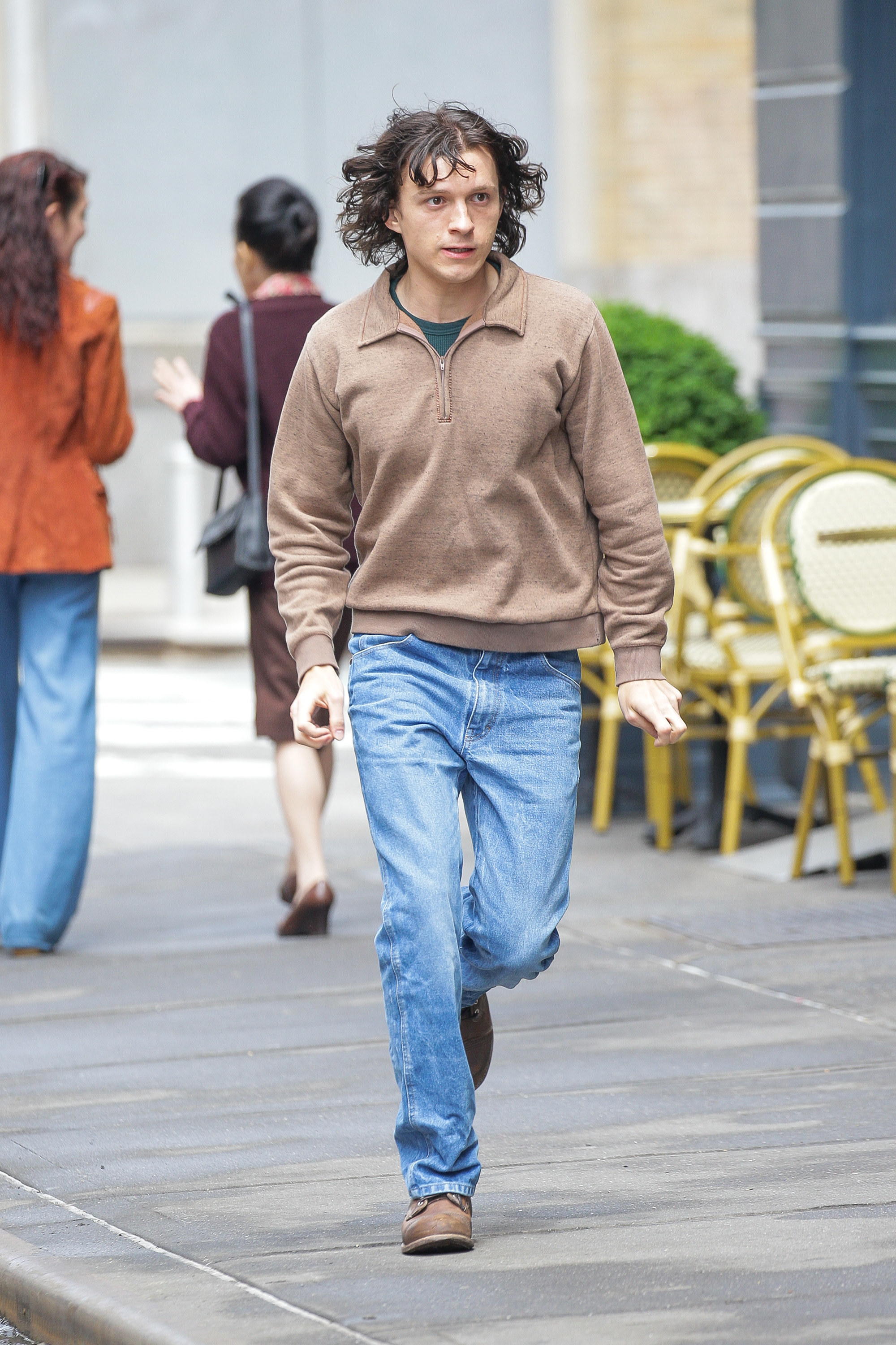 Close-up of Tom on the street in a scene from the show