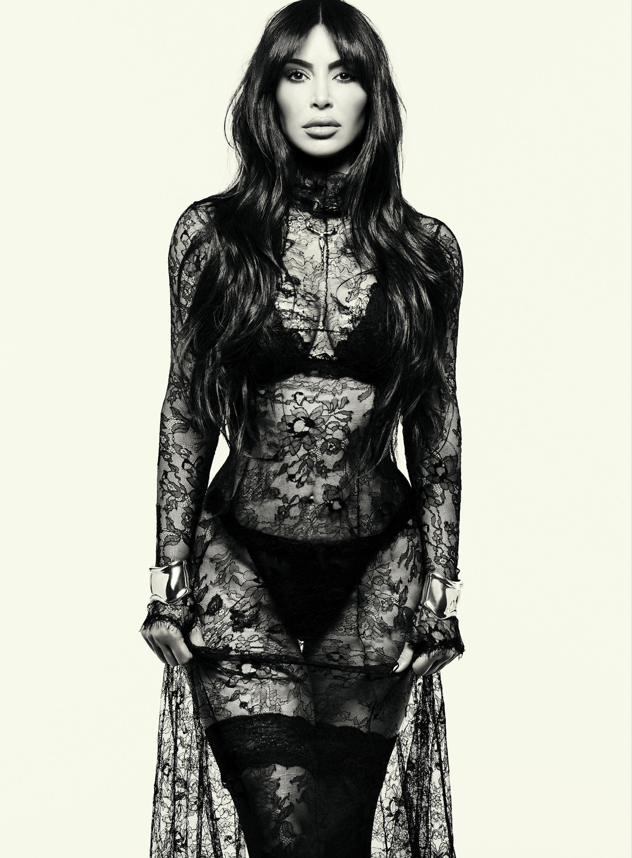 Kim in a lacy, diaphanous outfit