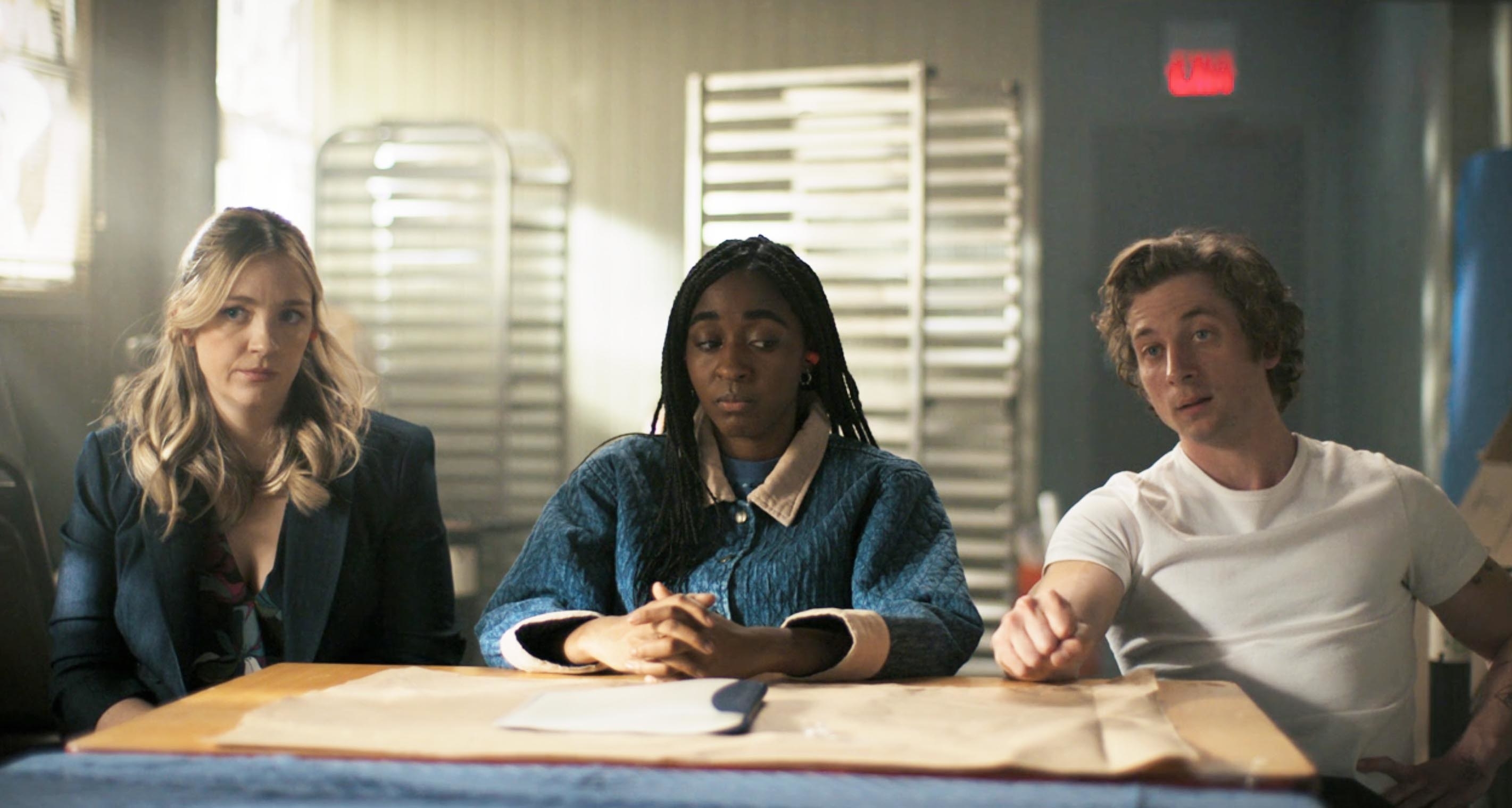 Carmy, Syd, and Sugar sit together at a table for a discussion