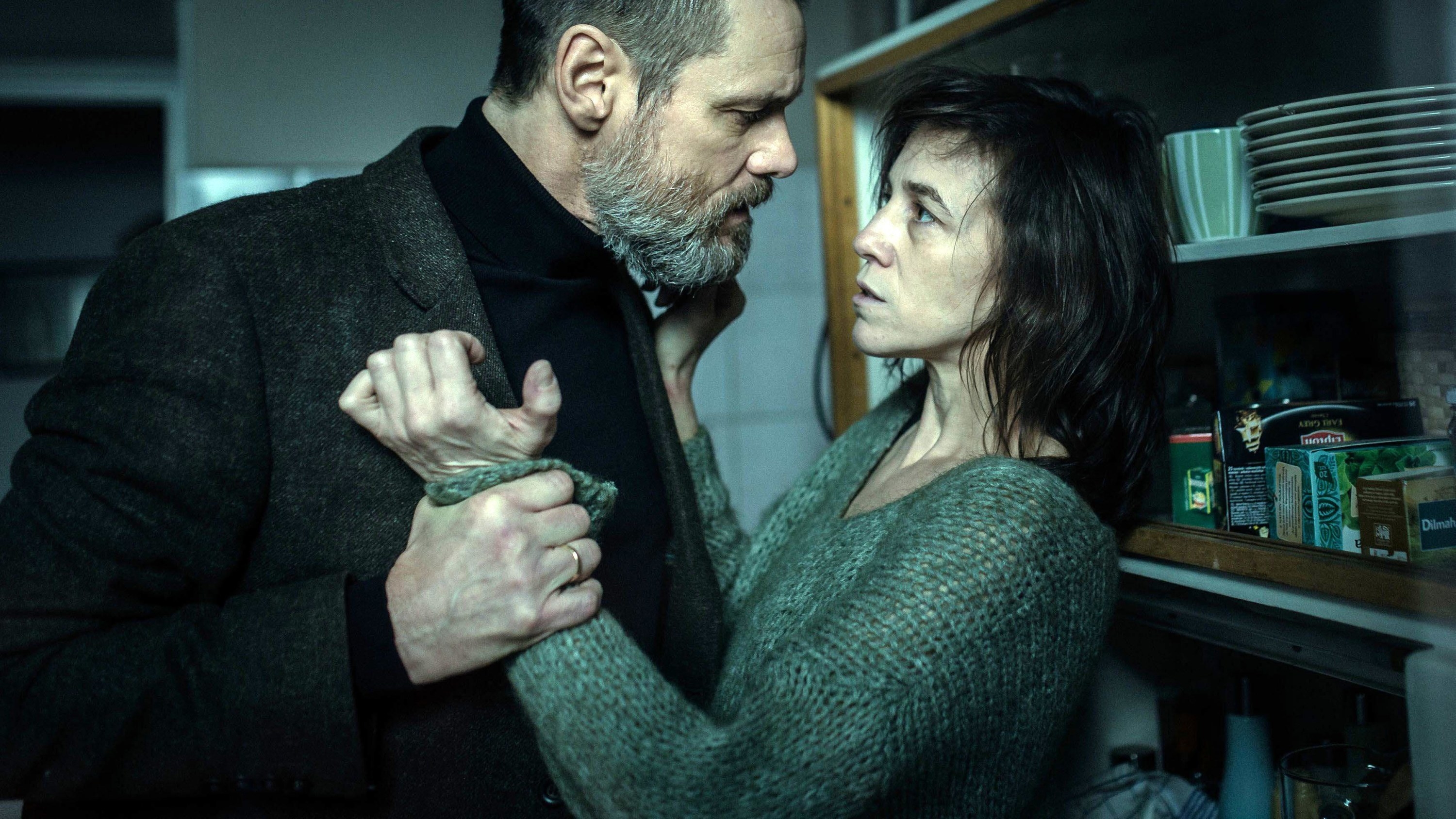 Still from the movie &quot;Dark Crimes&quot; depicting Jim Carrey interrogating Charlotte Gainsbourg in her home