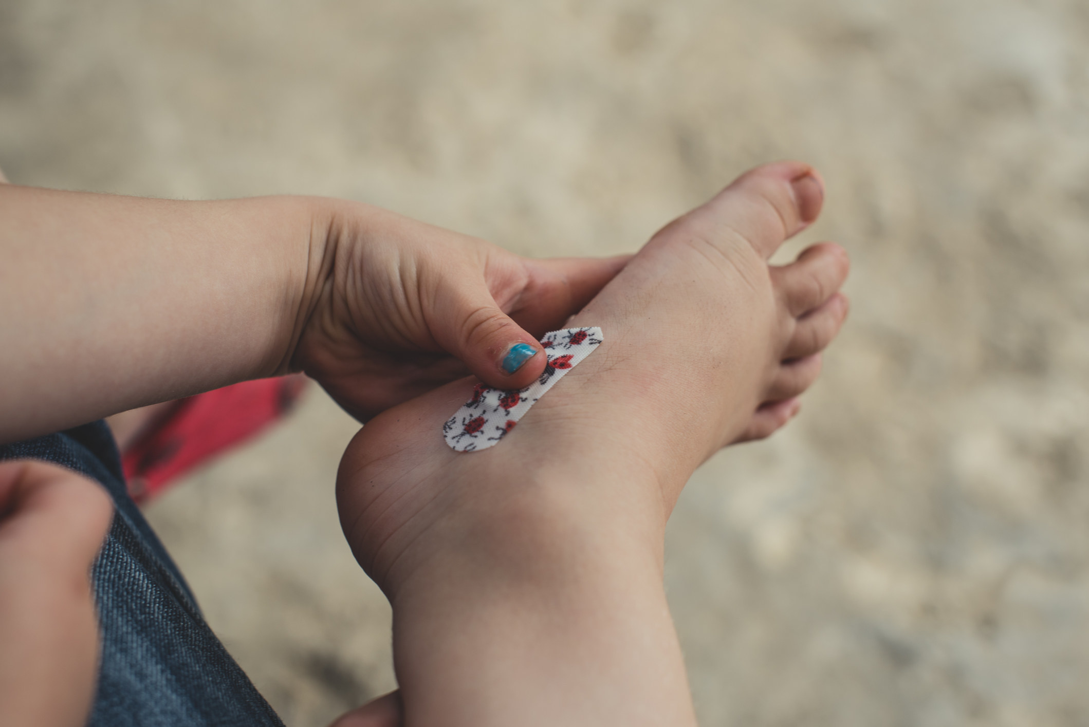 A bandage on a child&#x27;s foot