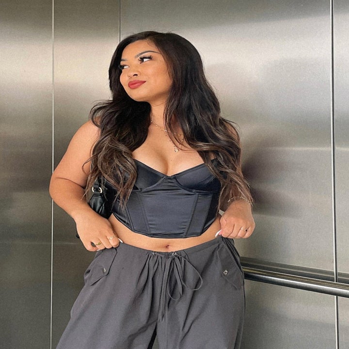 model wearing black corset