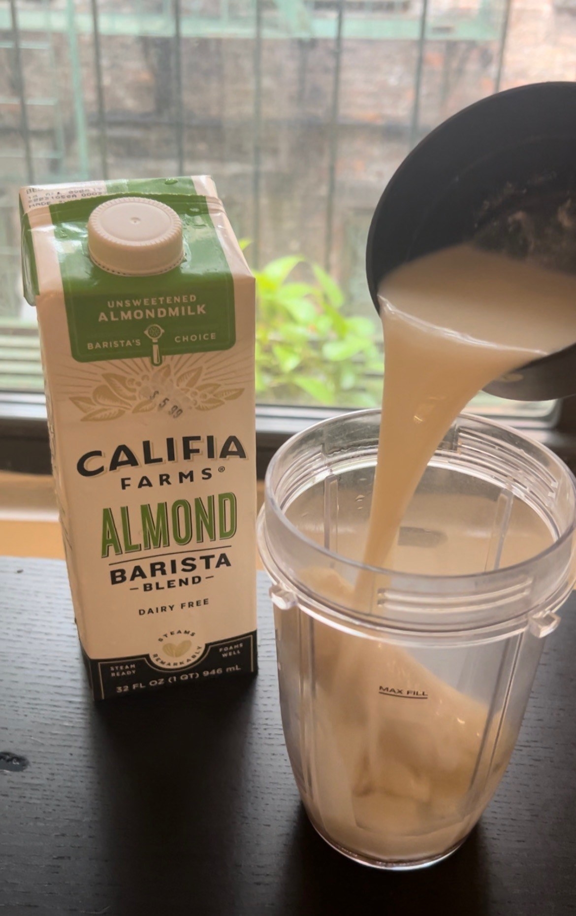 Pouring milk in a blender