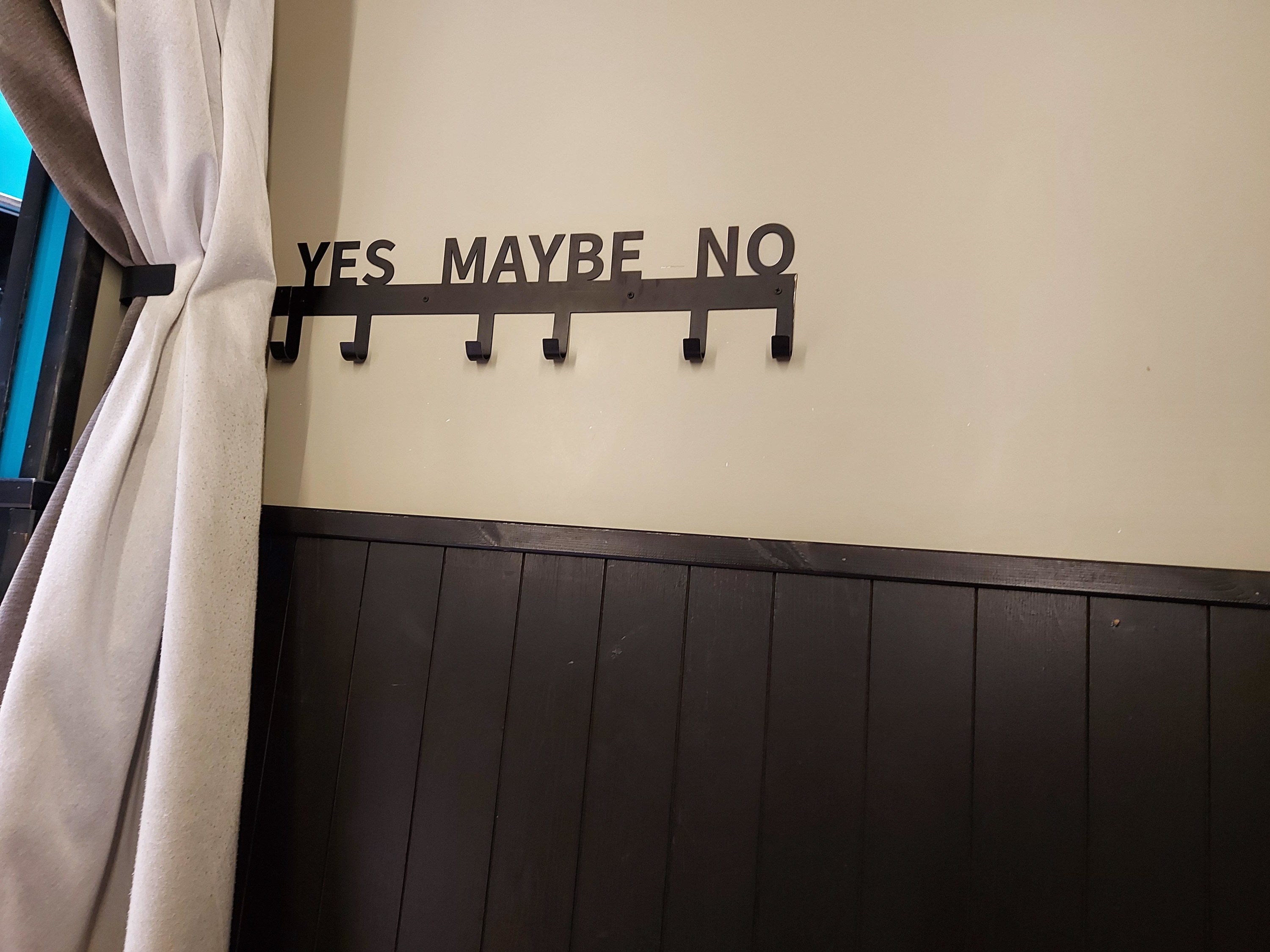A hanger saying &quot;Yes Maybe No&quot;