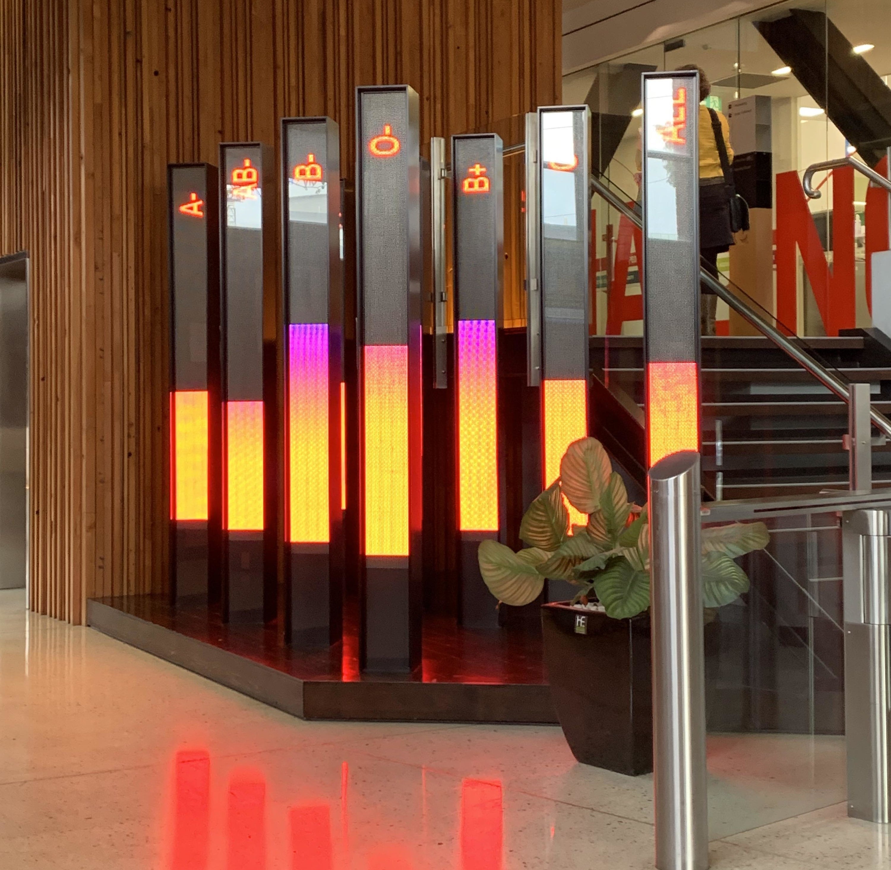 six tall digital displays with different blood types listed and a bar meter keeping track of how much volume each blood type has