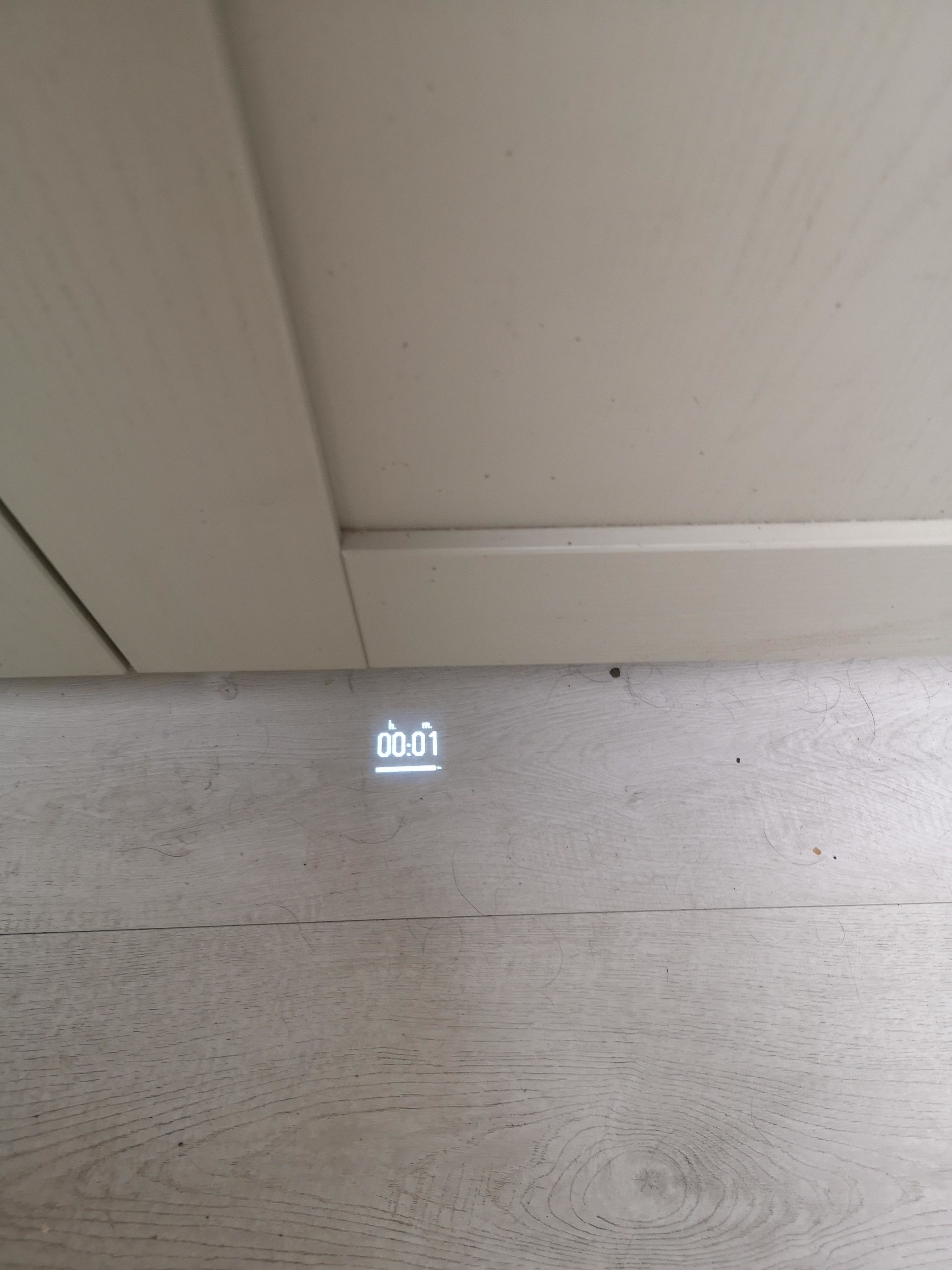 A timer projection on a dishwasher