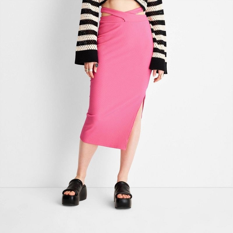 model wearing the skirt in cherry pink