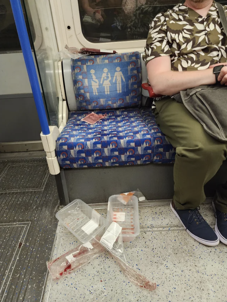 Empty meat packages on the floor of a train