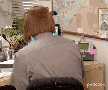 Dwight from &quot;The Office&quot; using Meredith&#x27;s wig.
