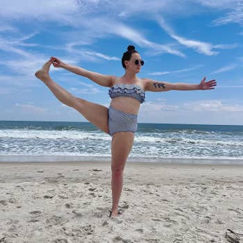 A reviewer in the striped strapless bikini