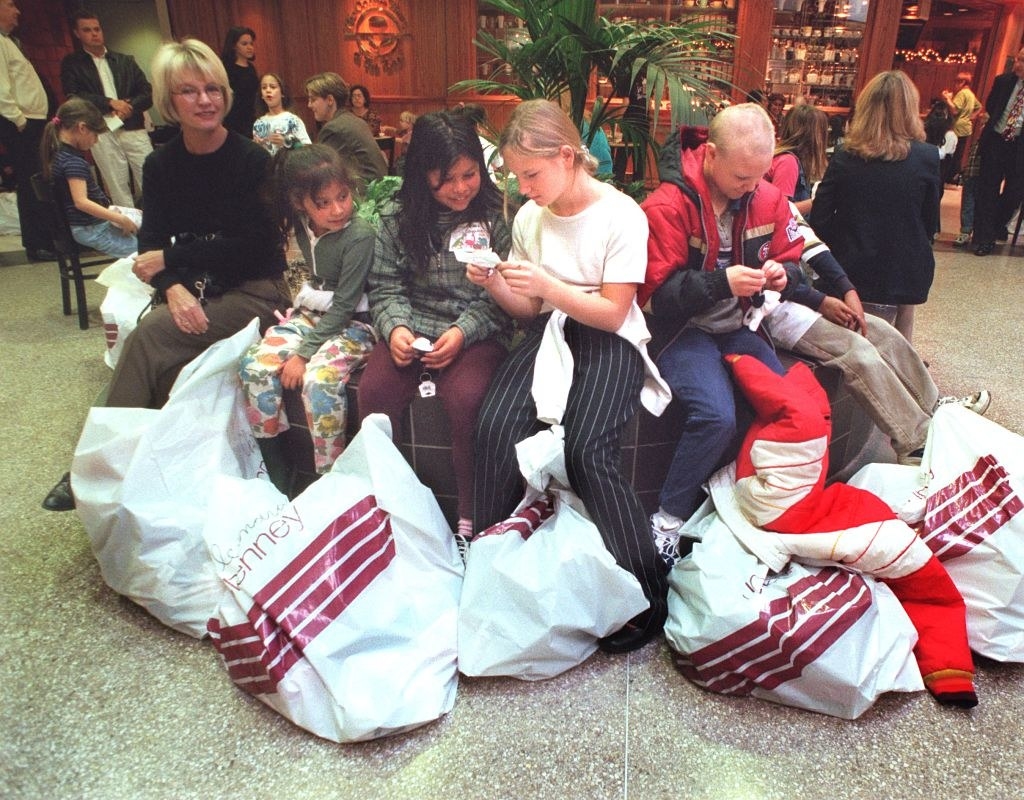 People with shopping bags in a mall