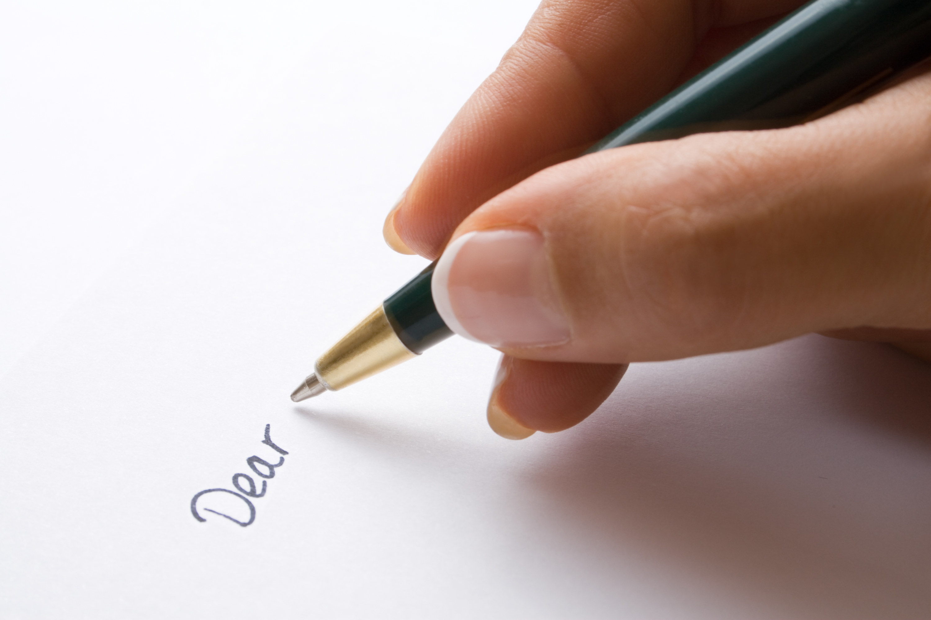 A person starting a letter with &quot;Dear&quot;