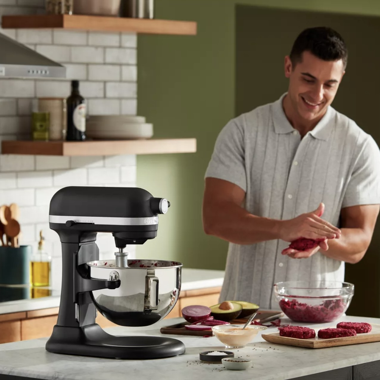 someone making vegetable patties while black stand mixer blends burger meal