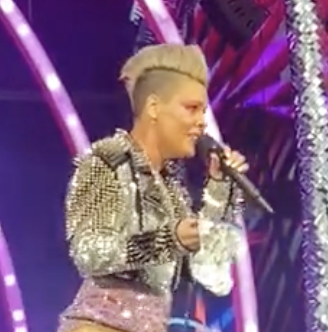 Close-up of Pink onstage looking shocked