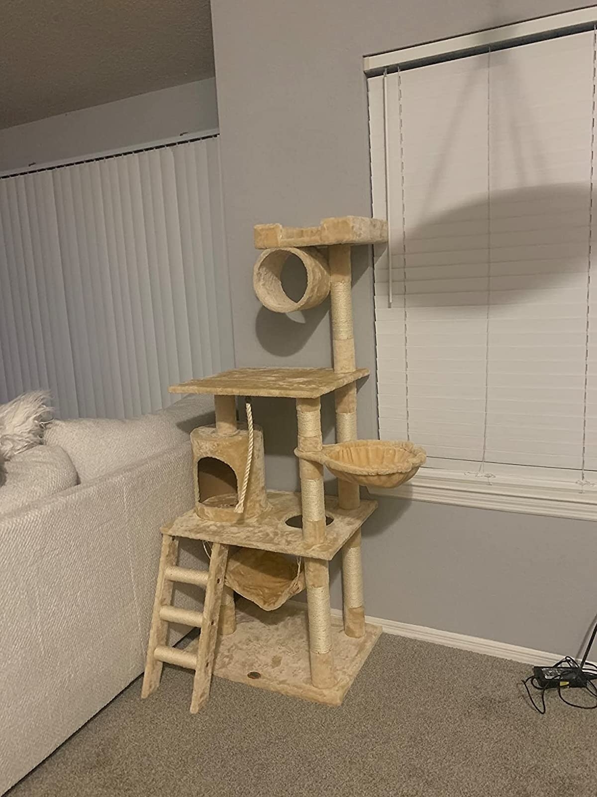 Reviewer&#x27;s photo of cat tree in a living room.