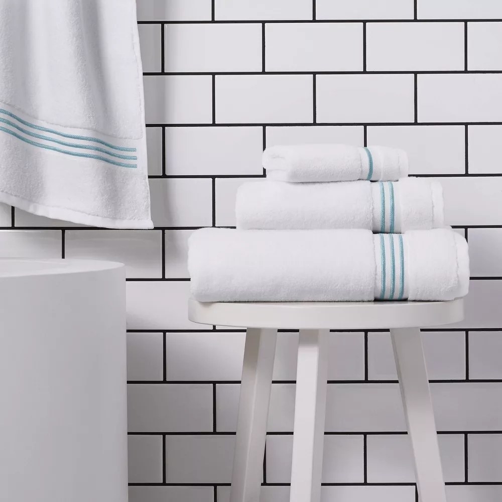 the towels in the color Aqua Stripe in a bathroom