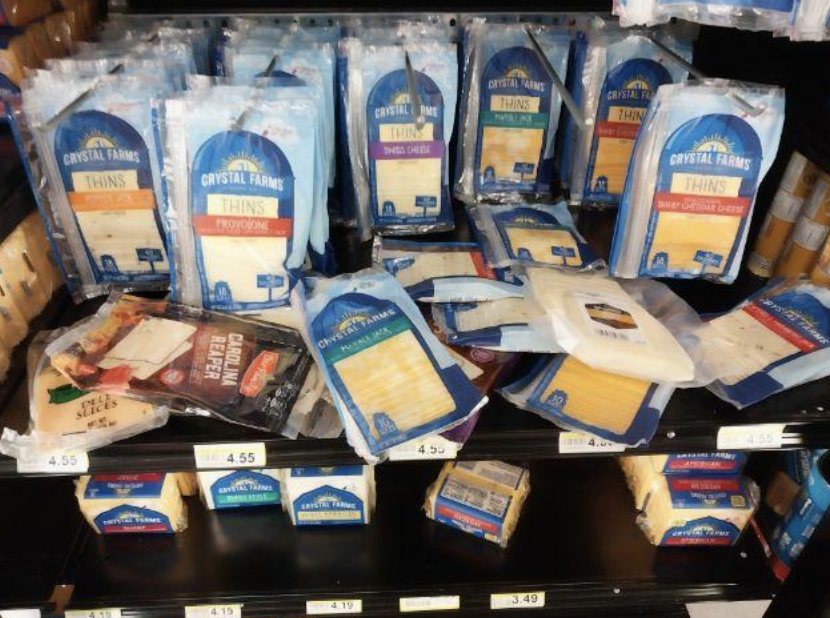Cheeses disorganized at grocery store