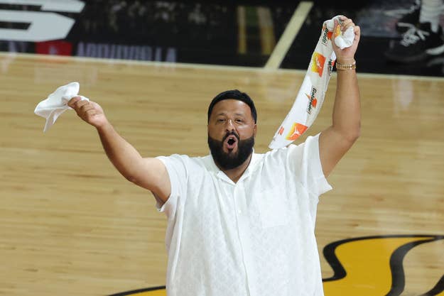 DJ Khaled is seen on the court during a timeout in Game Three of the 2023 NBA Finals between the Denver Nuggets and the Miami Heat at Kaseya Center