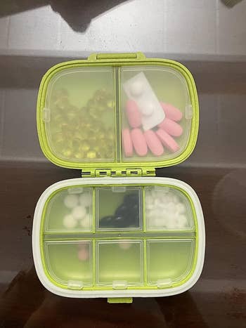 Reviewer's photo of pill organizer with pills inside.