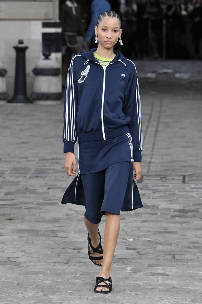 A model walks in a hybrid dress/tracksuit look for Wales Bonner&#x27;s Spring/Summer 2024 show