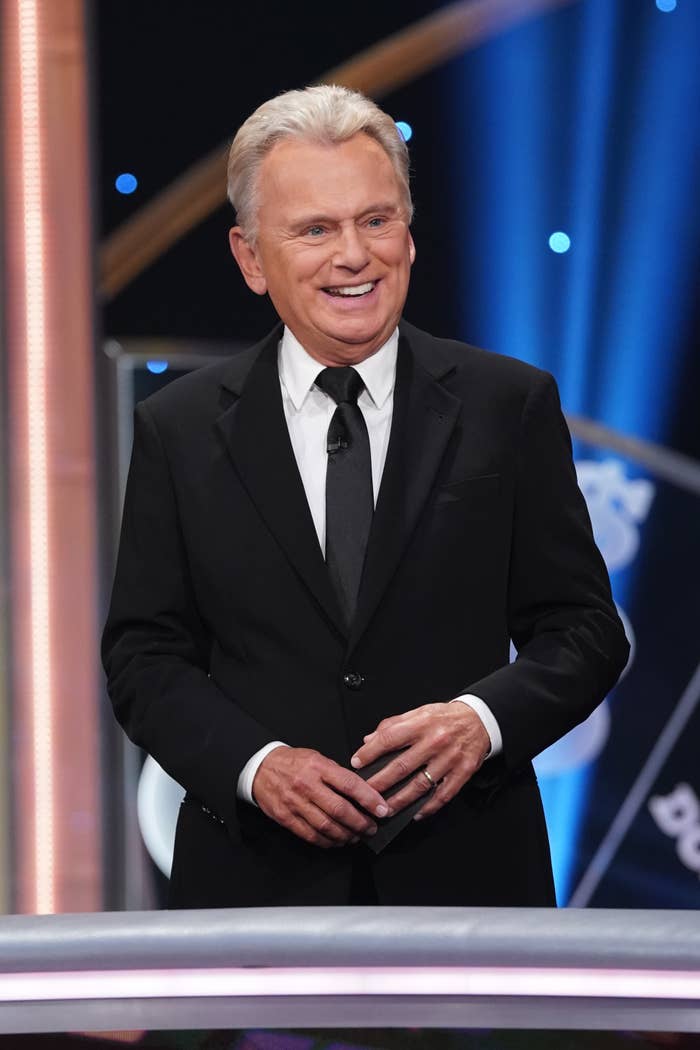 Pat Sajak smiles on the set of The Wheel of Fortune