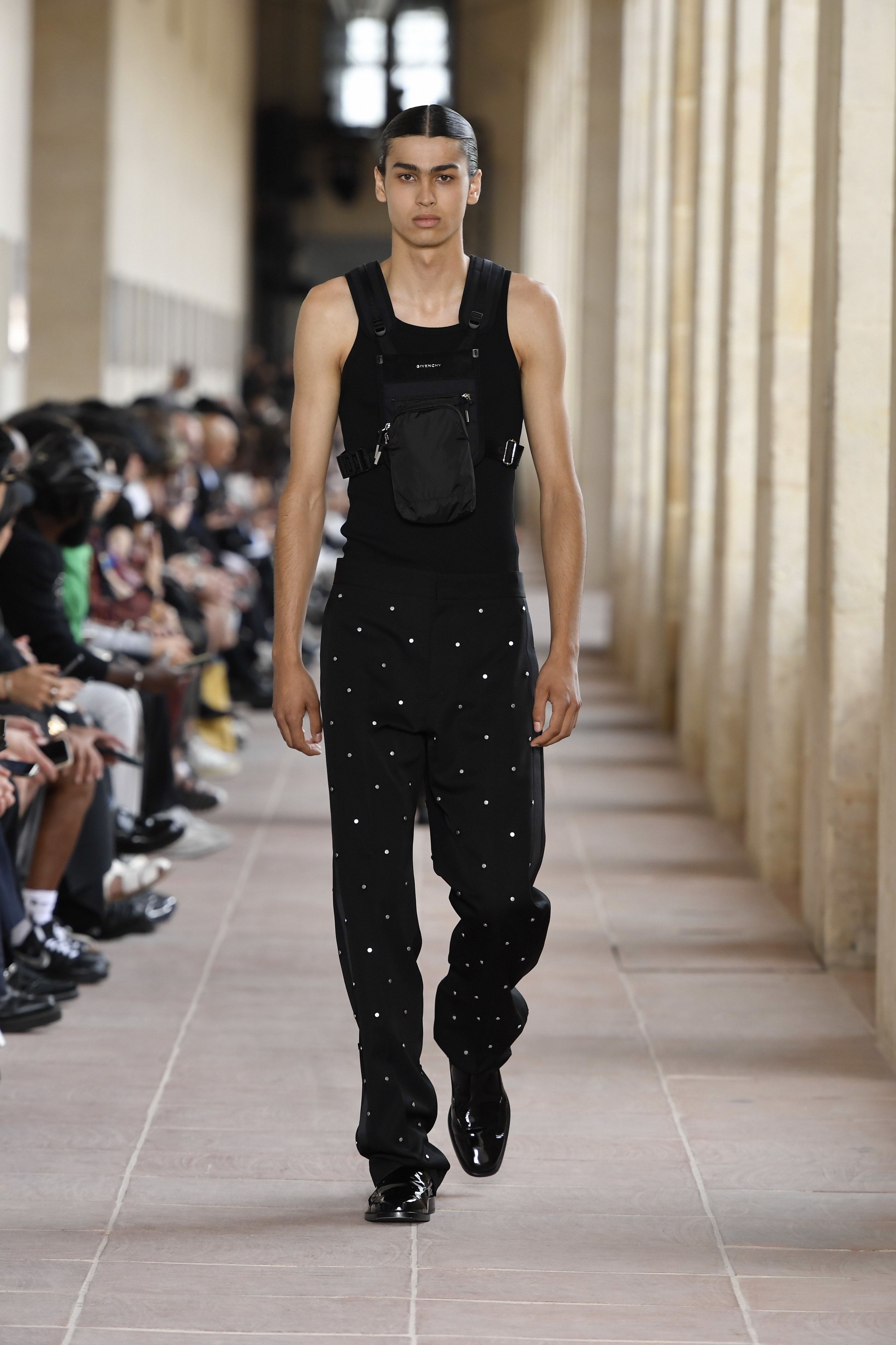 A model walks in an all-black look for Givenchy&#x27;s Spring/Summer 2024 show.