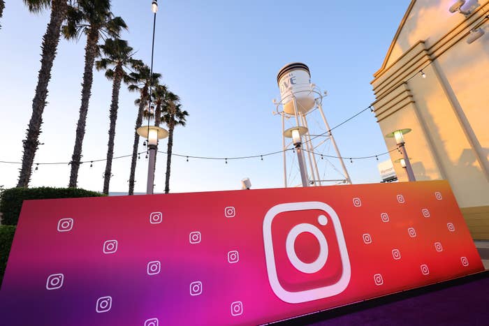 Instagram-branded signage in front of a water tower and palm trees in Anaheim, CA.